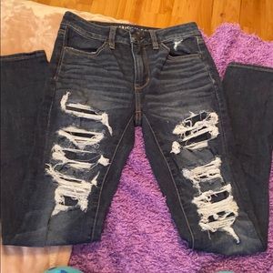 Dark wash ripped jeans with patches